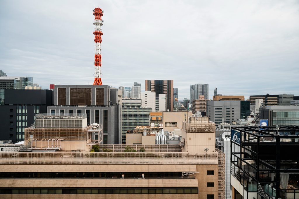 Urban skyline with communication tower